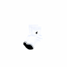 A pair of white crew socks for boys with a dark green toe for color coded sorting.
